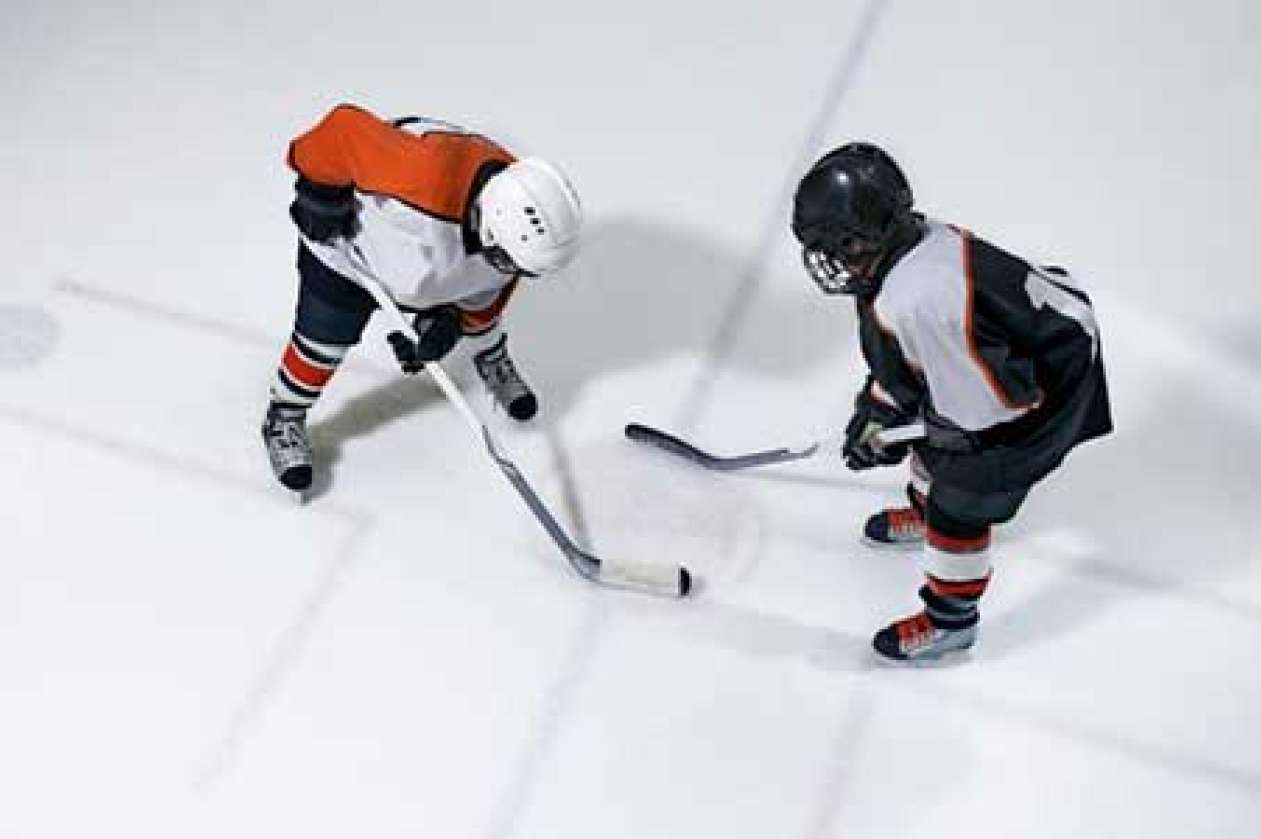 Young hockey players in a face off