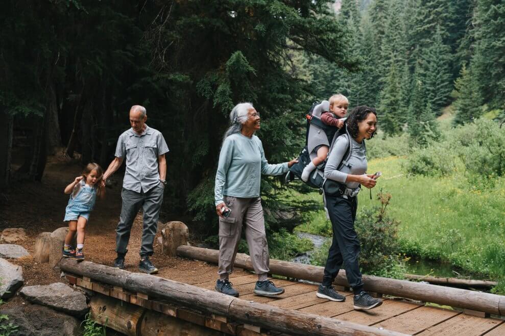 A mother hikes with her two children and her parents. Hiking games are a great way to add some fun to your nature walks.