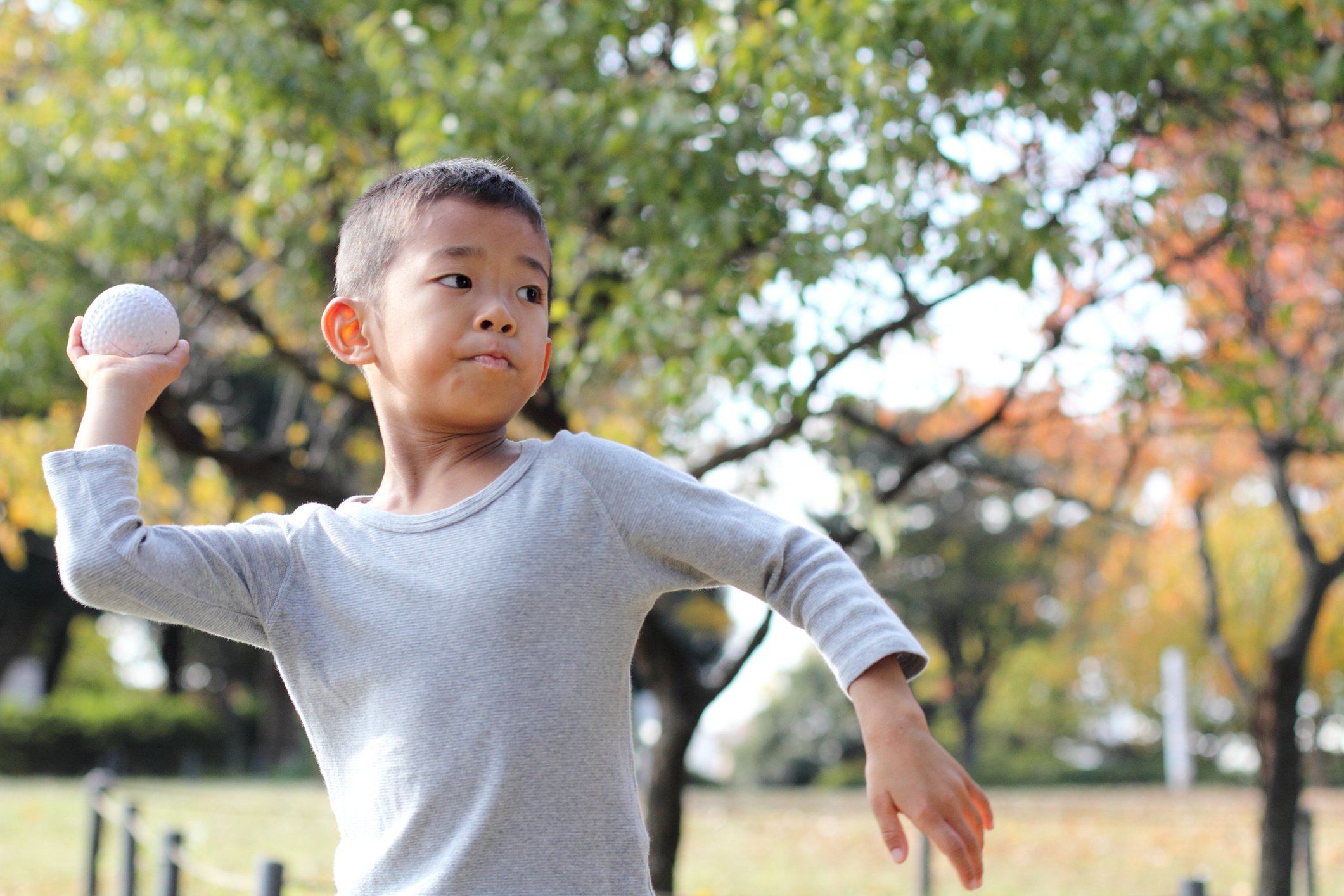 kid throwing ball