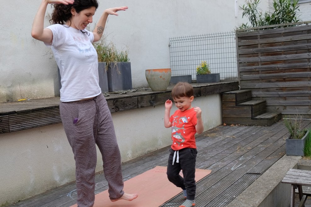 A mother and her toddler son demonstrate shaking out big feelings.