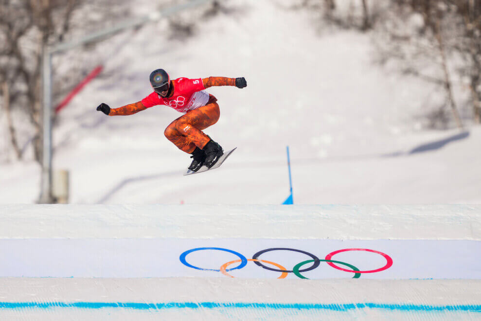 Team Canada snowboarder Eliot Grondin glides through the air at the Beijing 2022 Olympic Winter Games.