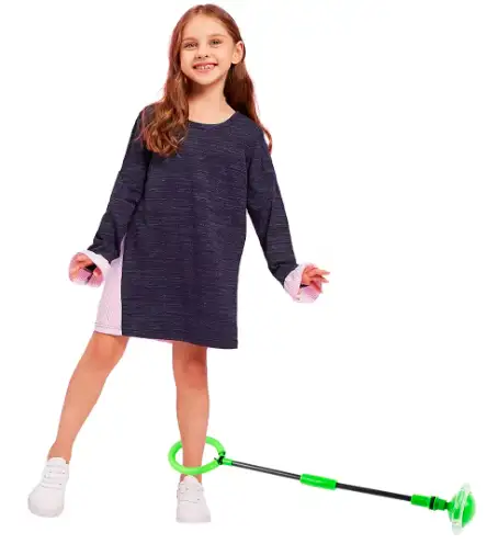 A girl wears the Skip It Ankle Toy on her ankle.