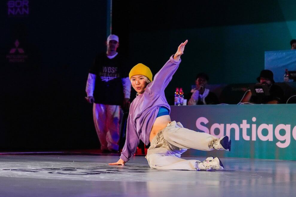 Tiffany Leung breakdances on stage.