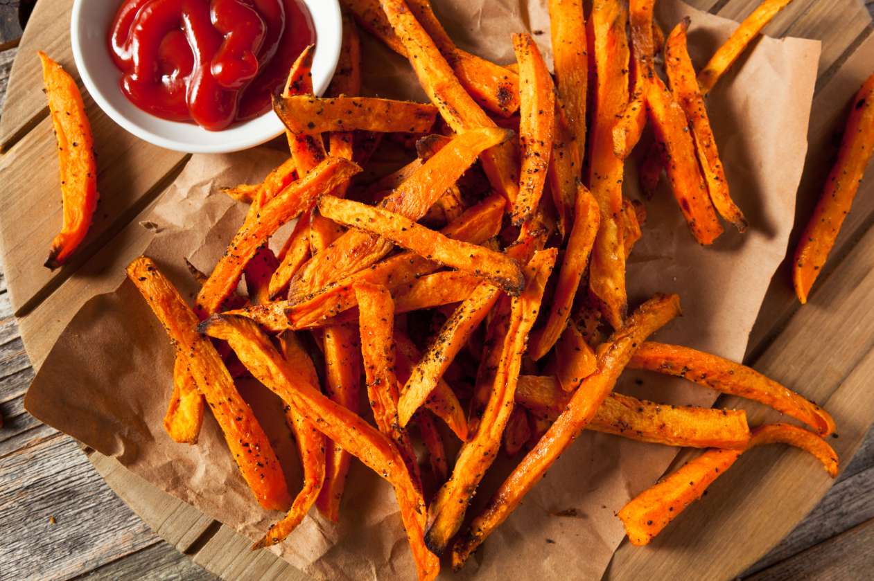 A plate of yam fries with ketchup