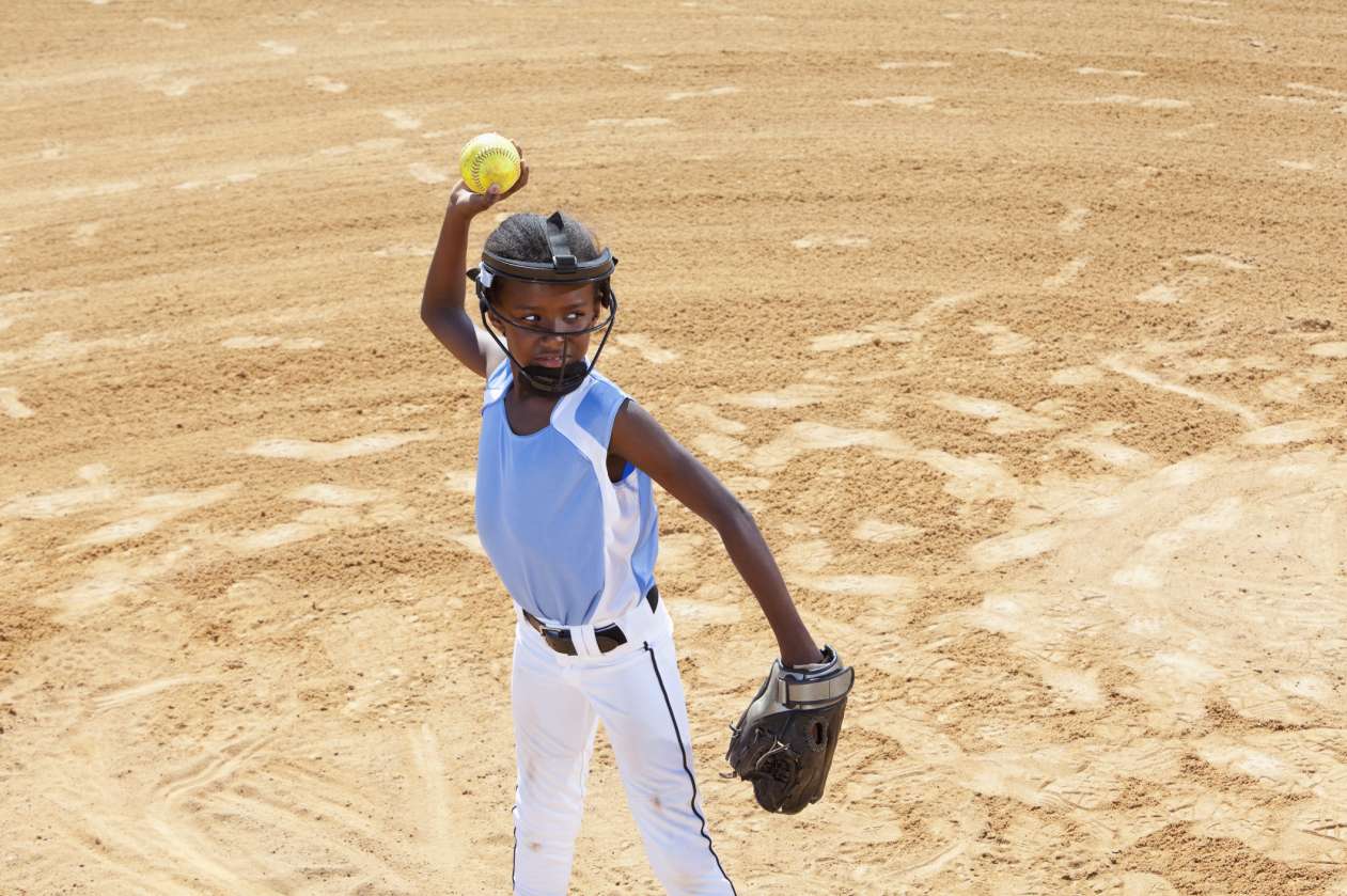 girl pitching softball