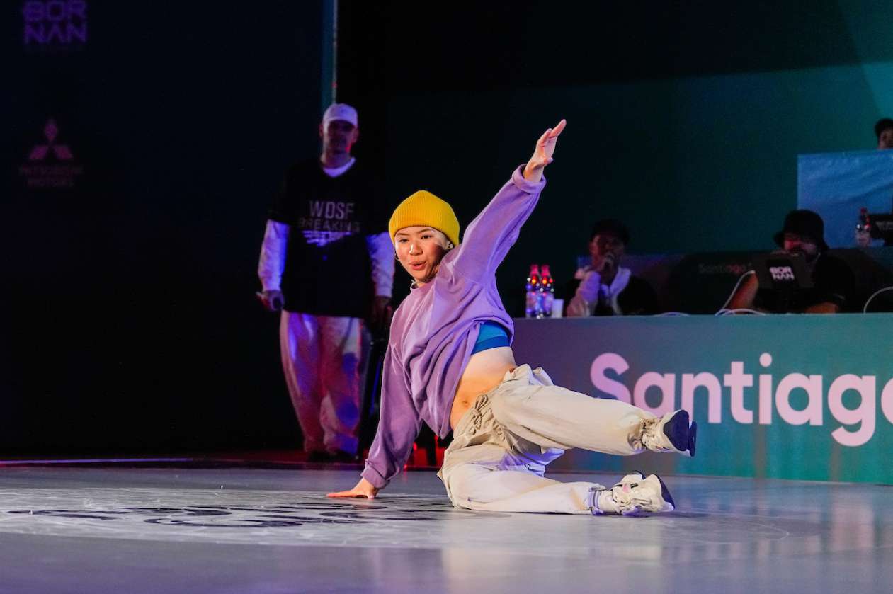 Canadian athlete Tiffany Leung breakdances on stage.